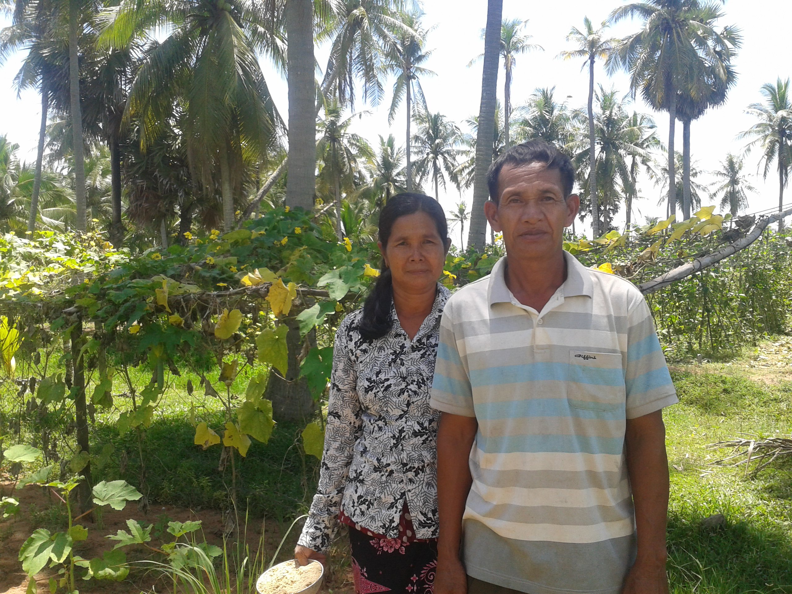 Wife and Husband in their vegetable garden, rural Cambodia, 2017. Photo: Sharada Keats