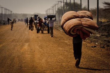 Citizens leave Abyei, a town on the border between South Sudan and the Sudan.
