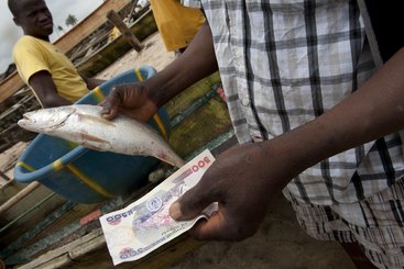 Selling freshly caught fish in Orimedu, Lagos State, Nigeria.