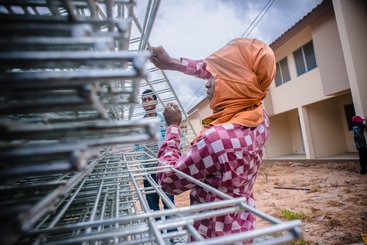 A woman on a construction site in Patayya, Thailand
