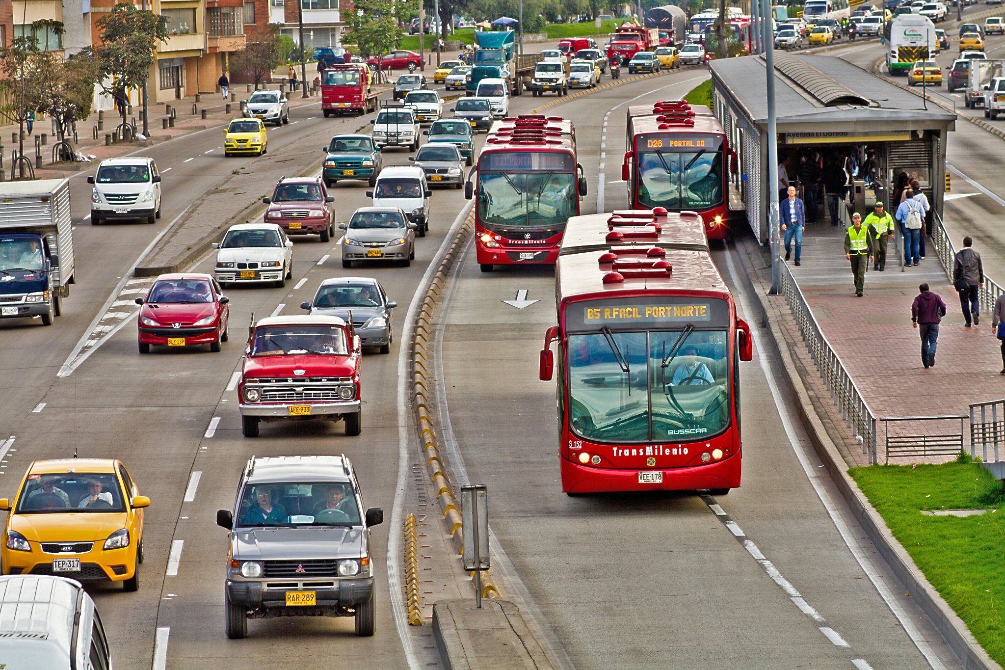 TransMilenio buses, part of Bogotá’s bus rapid transit system, travel down lanes separated from regular motorised traffic.