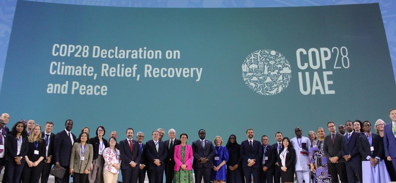 Leaders pose for a photo to mark the launch of the COP28's first ever Climate, Relief, Recovery and Peace Declaration, in Dubai on 3 December 2023