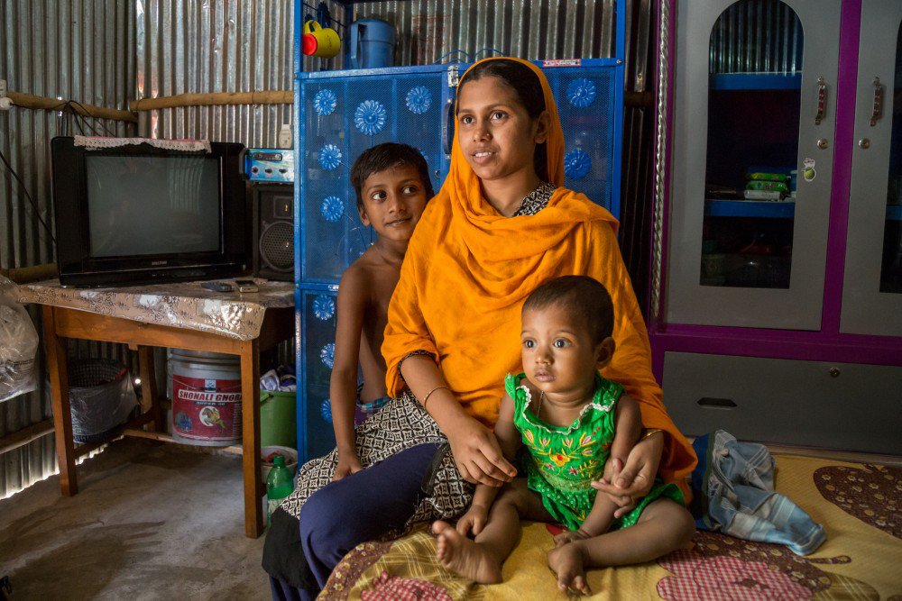 Adolescent married girl with her two children in Dhaka, Bangladesh