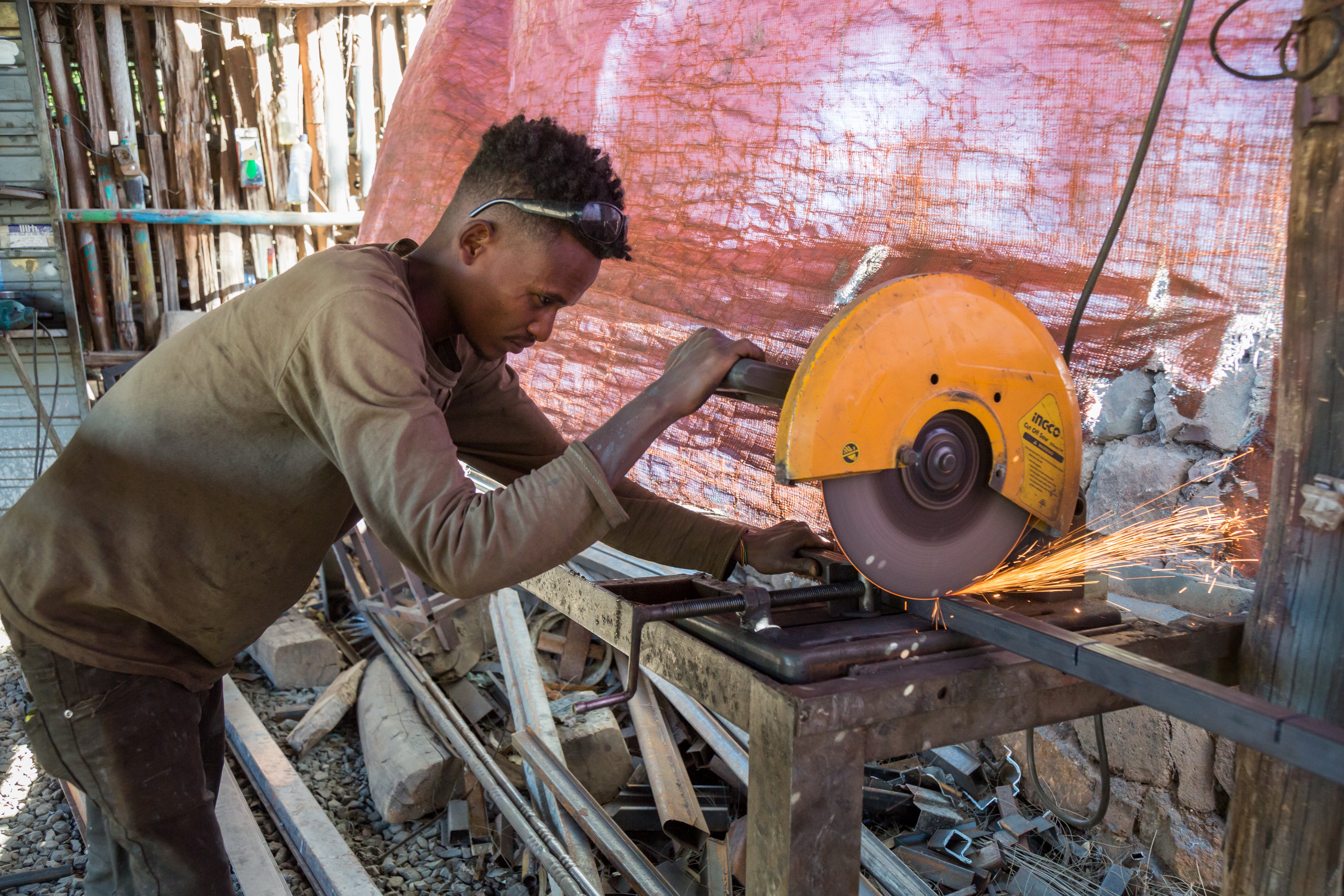 An adolescent boy working as a metal worker in Ethiopia