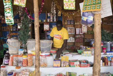 South Sudanese refugee and entrepreneur, Jacob, at the shop he owns in the market in Nyumanzi refugee settlement, Uganda