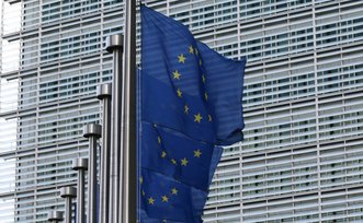 EU flags against the European Commission Berlaymont building
