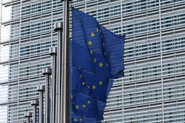 EU flags against the European Commission Berlaymont building