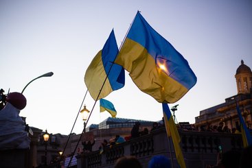 Photo: Protesters wave Ukrainian flags in London, March 2022. Karollyne Videira Hubert on Unsplash