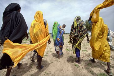  Women leaving a camp for internally displaced persons to collect firewood, Gereida, South Darfur, Sudan