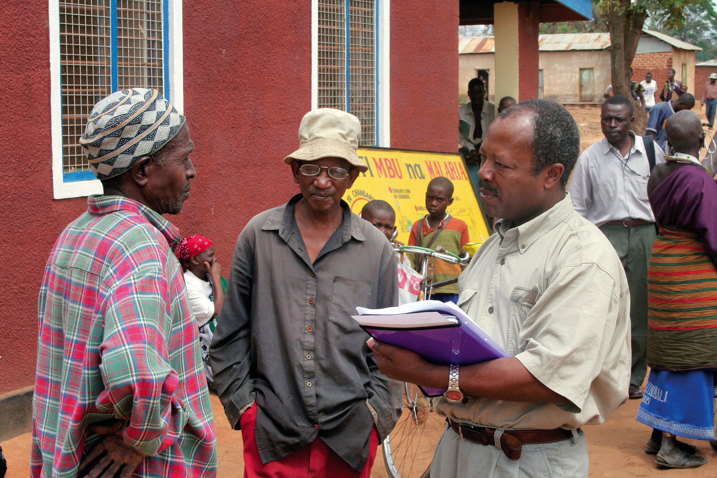 Community Eye Health worker interviewing patient before surgery in Tanzania