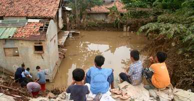 Children play on the high ground after flood