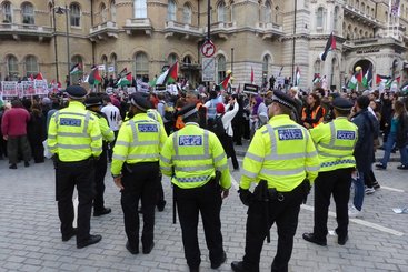 Pro Palestine supporters march through central London, October 2023.